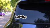 Dark Hairy Mustache Sticker on a Rear Car Window (New) example