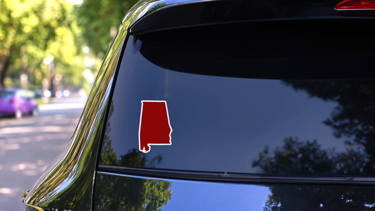 Deep Dark Red Alabama Map Sticker on a Rear Car Window (New) example