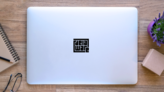 Delaware Typography Logo Sticker on a Laptop (New) example