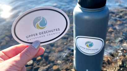 Custom Charity Oval Stickers for Upper Deschutes Watershed Council Applied to a Water Bottle