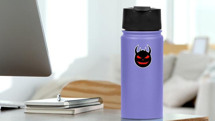 Devil Face With Red Eyes Sticker on a Water Bottle (New) example