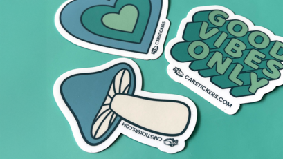 Custom Die Cut Stickers of Artwork Laid out On Table