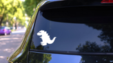 Dinosaur Sticker on a Rear Car Window (New) example