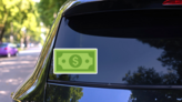 Dollar Bill Sticker on a Rear Car Window (New) example