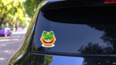 Dollar Sign Eyes Emoji Sticker on a Rear Car Window (New) example