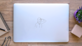 Drawing Of Woman Covering Her Nose Sticker on a Laptop (New) example