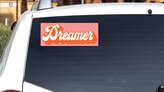 Dreamer Retro Bumper Sticker on a White Car Rear Window example