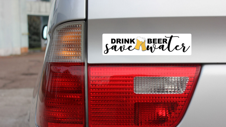 Drink Beer, Save Water Bumper Sticker on a Gold Car Rear Bumper example