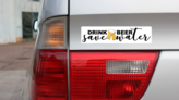 Drink Beer, Save Water Bumper Sticker on a Gold Car Rear Bumper example