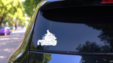 Driving Lawn Mower Sticker on a Rear Car Window (New) example