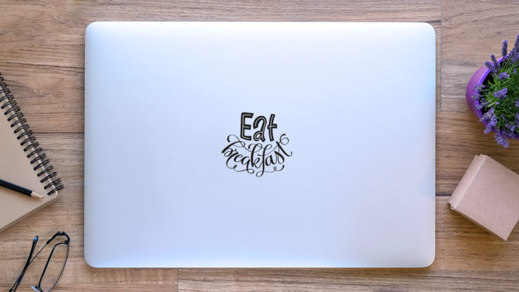 Eat Breakfast Hand-lettered Sticker on a Laptop (New) example