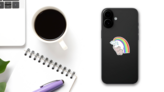 Elephant Spraying Water And Rainbow Sticker on a Phone (New) example