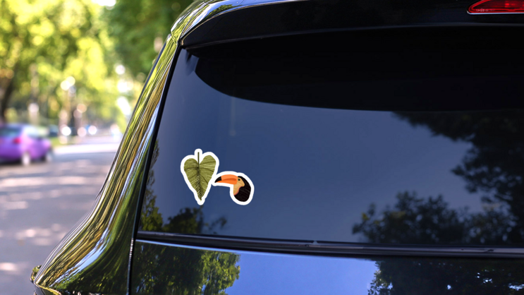 Embroidered Tropics: Toucan Sticker on a Rear Car Window (New) example