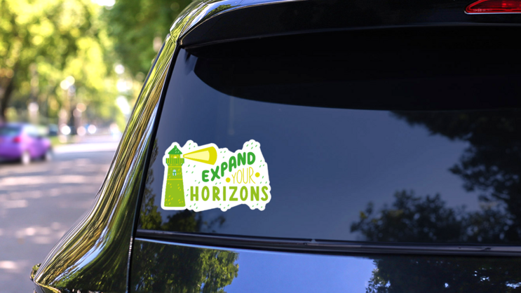 Expand Your Horizons Green Lighthouse Sticker on a Rear Car Window (New) example
