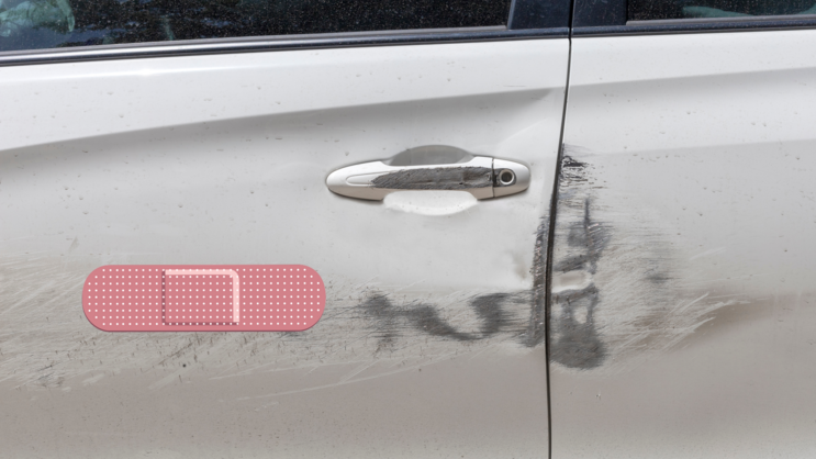 Faded Red Bandage Sticker on a Scratched Car example