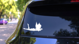 Fairy Laying Down Holding Flower Sticker on a Rear Car Window (New) example