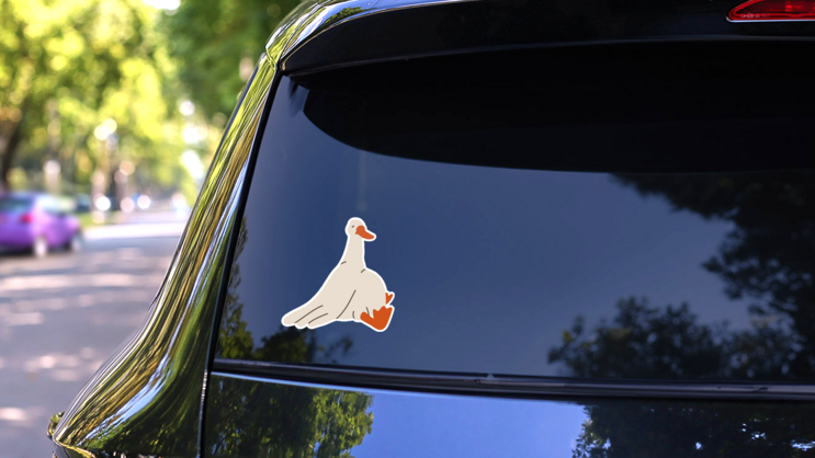 Fat Goose Sits Sticker on a Rear Car Window (New) example