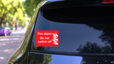 Fire Alarm Do Not Switch Off Sign Sticker on a Rear Car Window (New) example