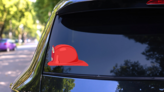 Fireman Helmet Side View Sticker on a Rear Car Window (New) example