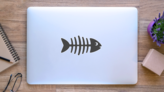 Fish Skeleton Sticker on a Laptop (New) example