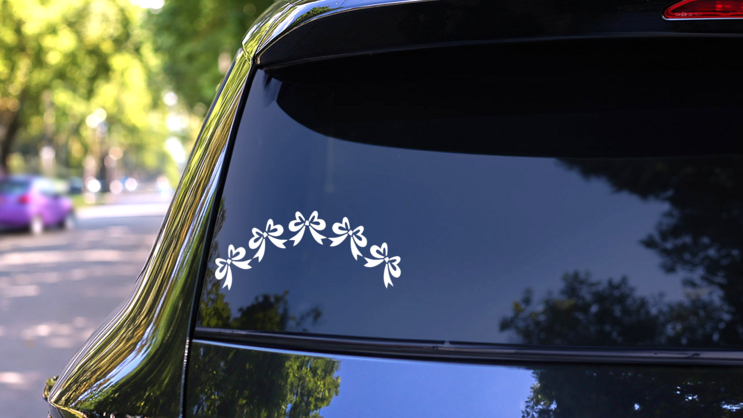 Five Bows Arch Sticker on a Rear Car Window (New) example