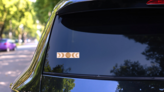 Floral Moon Phase Pink Sticker on a Rear Car Window (New) example