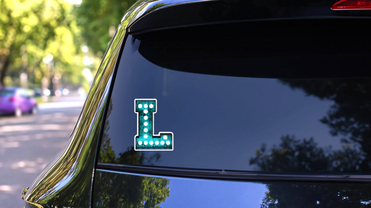 Fluorescent Blue Neon Font Letter L Sticker on a Rear Car Window (New) example