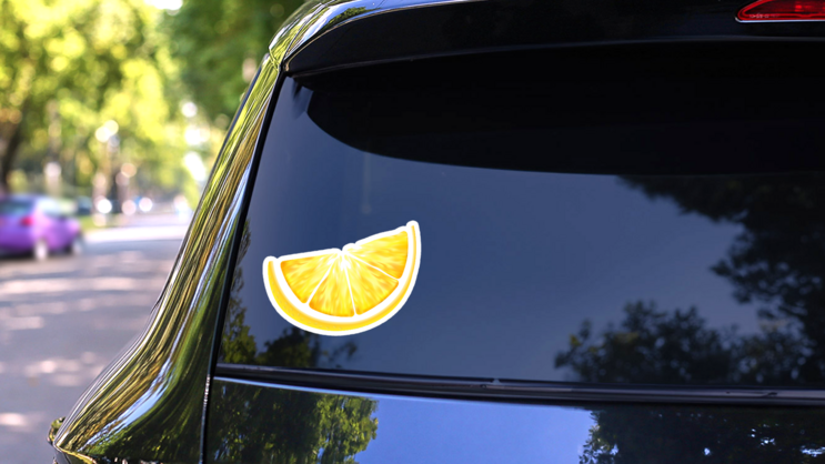 Fresh Juicy Lemon Slice Sticker on a Rear Car Window (New) example
