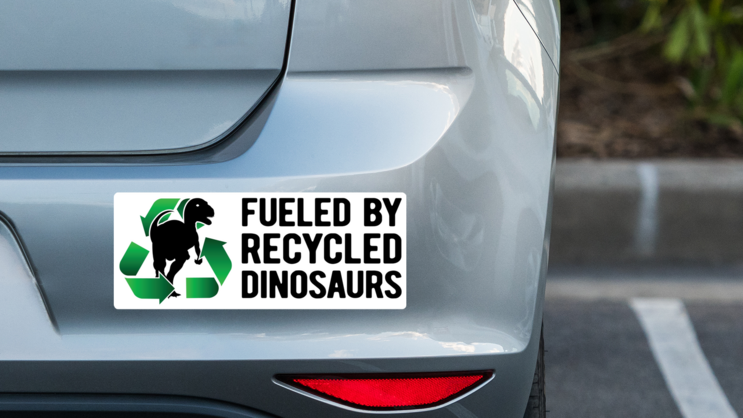 Fueled By Dinosaurs Bumper Sticker on a Grey Car Bumper example