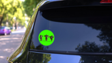 Funny Brown Gorilla Dancing Neon Green Sticker on a Rear Car Window (New) example