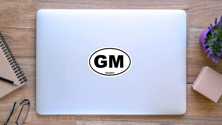 Gambia Gm Oval Sticker on a Laptop (New) example