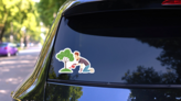 Gardener Landscaper Working Watering Tree Cartoon Sticker on a Rear Car Window (New) example