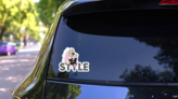 Girl Sitting In A Stylish Inscription Sticker on a Rear Car Window (New) example