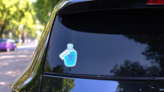 Glass Bottle With Zodiac Aquarius Constellation Inside Sticker on a Rear Car Window (New) example