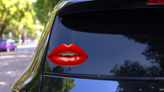 Glossy Female Red Lips Sticker on a Rear Car Window (New) example