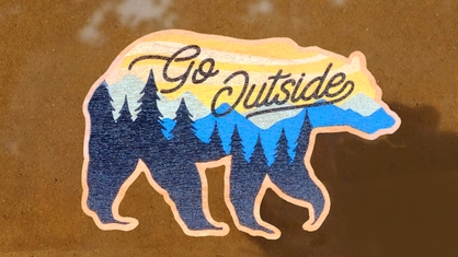 Go outside wood sticker on window