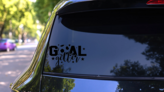 Goal Getter Sport Saying Soccer Ball Sticker on a Rear Car Window (New) example