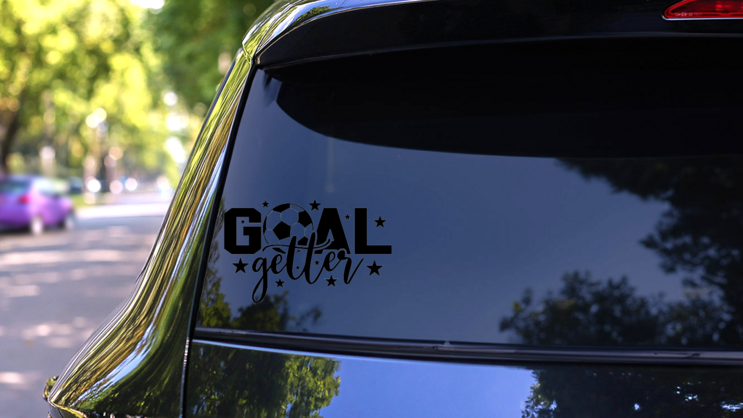 Goal Getter Sport Saying Soccer Ball Sticker on a Rear Car Window (New) example