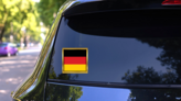 Golden Frame Germany Flag Square Sticker on a Rear Car Window (New) example