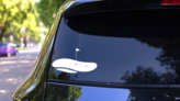 Golf Ball Close To Hole Sticker on a Rear Car Window (New) example