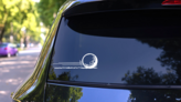 Golf Ball Moving Quickly Sticker on a Rear Car Window (New) example