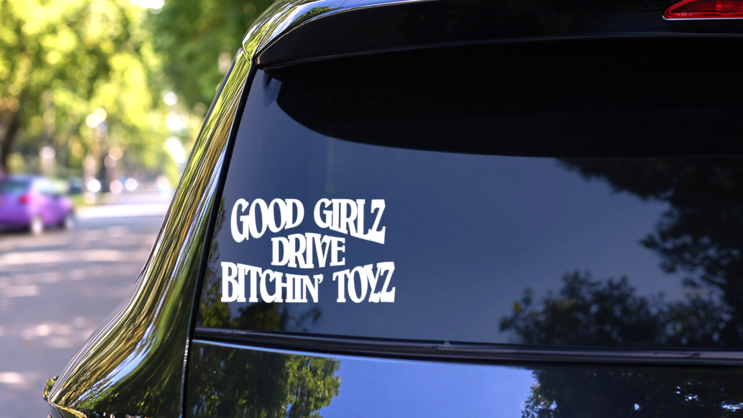 Good Girlz Drive Awesome Toyz Sticker on a Rear Car Window (New) example