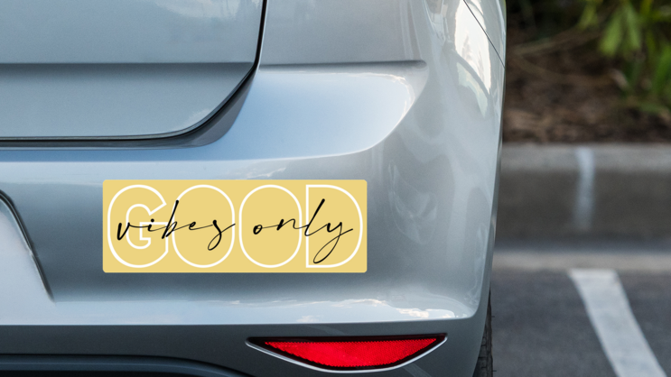 Good Vibes Only Bumper Sticker on a Grey Car Bumper example