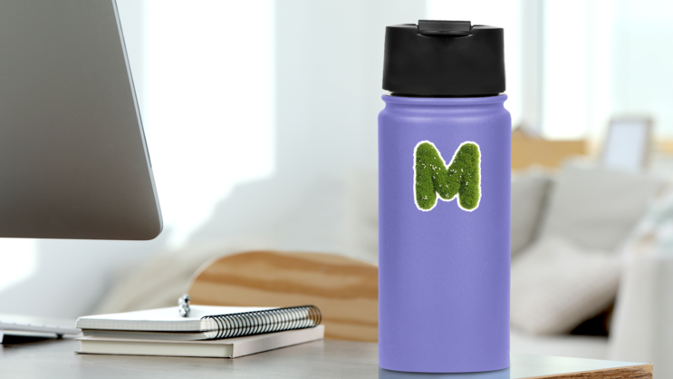 Grass and Flowers Font Letter M Sticker on a Water Bottle (New) example