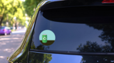 Green Aluminum Can With Recycling Symbol Sticker on a Rear Car Window (New) example