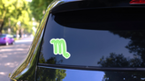 Green Neon Zodiac Sign Scorpio Sticker on a Rear Car Window (New) example