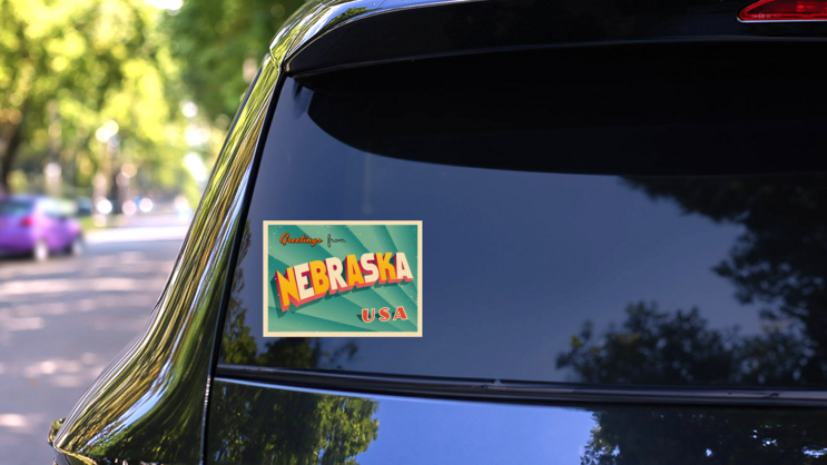 Greetings From Nebraska Sticker on a Rear Car Window (New) example