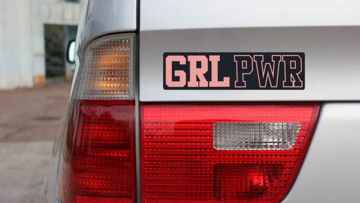 GRL PWR Bumper Sticker on a Gold Car Rear Bumper example