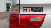 GRL PWR Bumper Sticker on a Gold Car Rear Bumper example