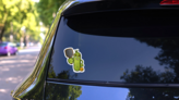 Grumpy Pickleball Cartoon Sticker on a Rear Car Window (New) example